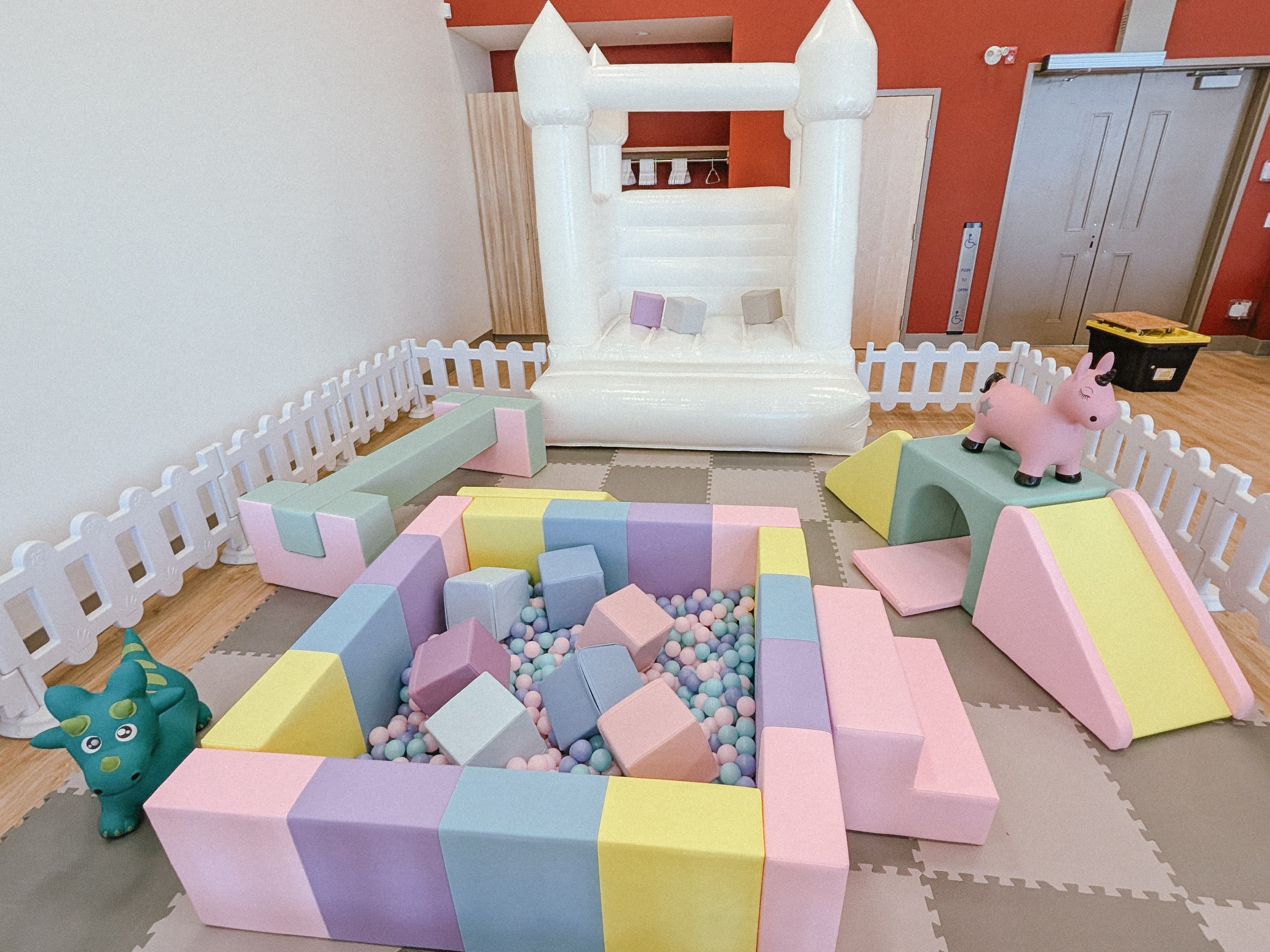 Pastel soft play with slide and ball pit for toddlers